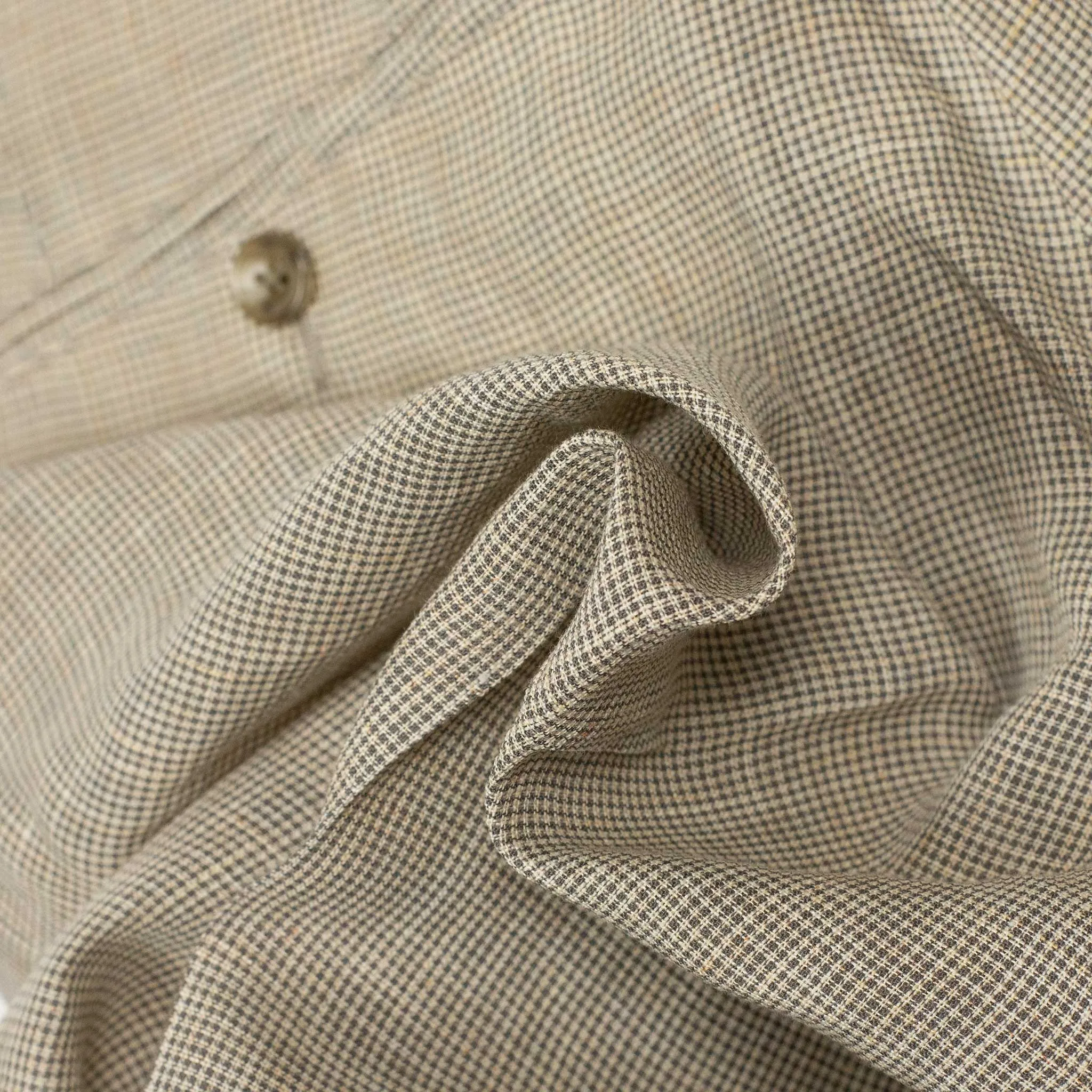 Pleated tapered trousers in ivory houndstooth linen and cupro